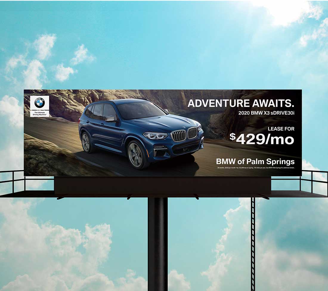 BMW of Palm Springs OOH Advertising - X3 on desert road with headline: Adventure Awaits.