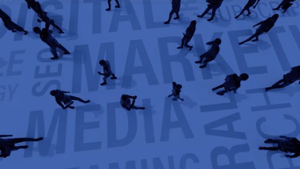 Top view of silhouetted people walking on a blue surface, where large words like "MEDIA," "DIGITAL MARKETING," and "STREAMING" are visible beneath them. The image conveys a sense of a busy, emotional content-driven, digital-focused environment.